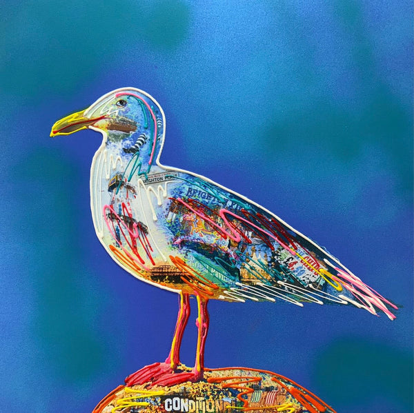 Hand embellished Brighton seagull, against a rich blue background